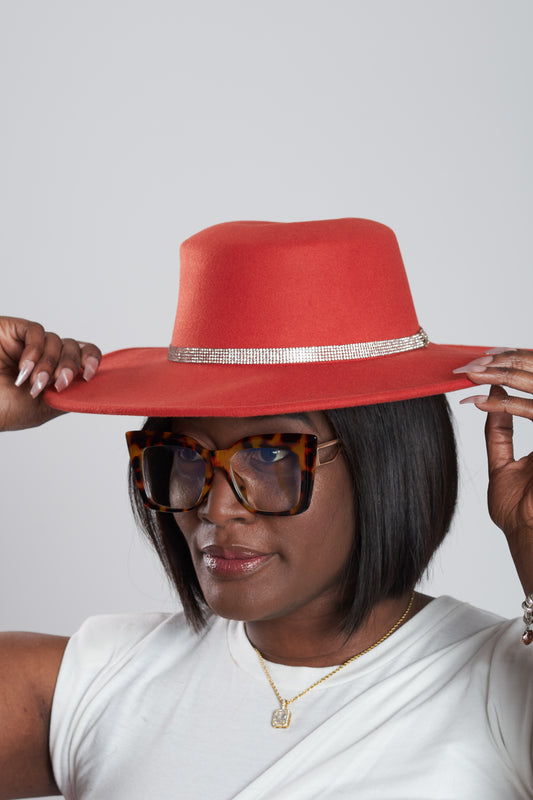 Woman wearing a red hat with a white background